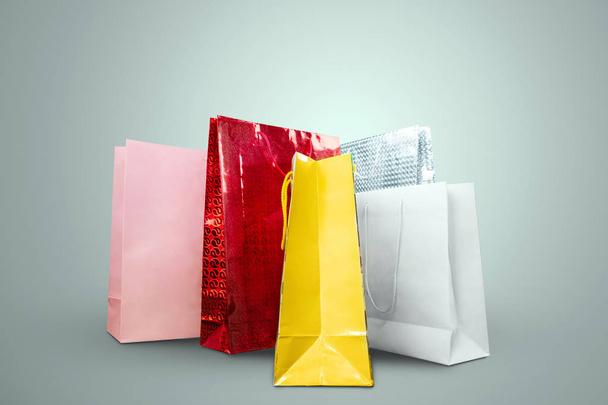 Packages from stores on a light background. Let's go shopping. The problem in shopping, obsession, discounts. - Фото, изображение