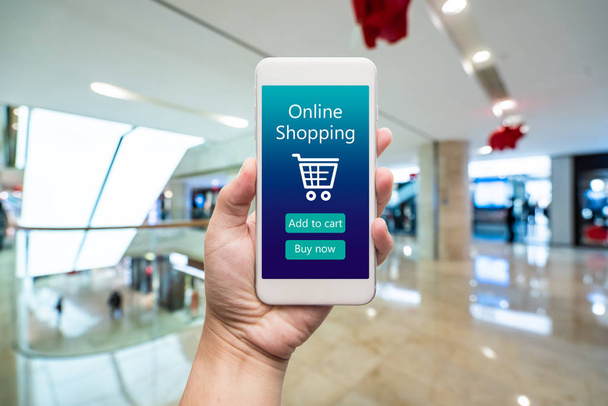 Smart phone online shopping in woman hand. Shopping center in ba - Photo, Image