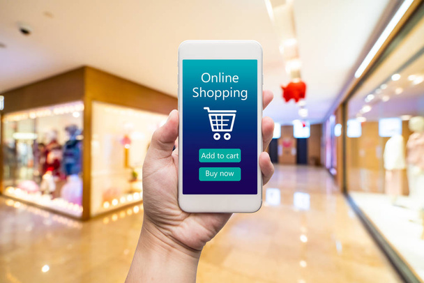 Smart phone online shopping in woman hand. Shopping center in ba - Photo, Image