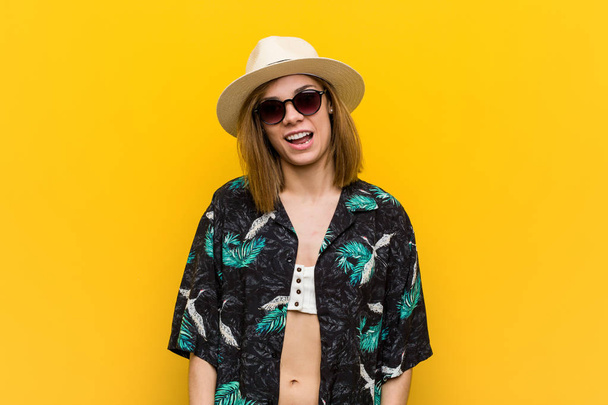 Young pretty woman wearing a hawaiian shirt very happy over yell - Photo, Image
