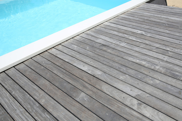 Detail of swimming-pool and wooden deck - Foto, Imagen