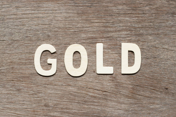 Алфавіт лист в слово золото на дереві фону - Фото, зображення