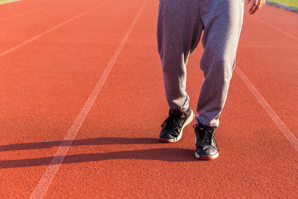 Sport Man jogging or exercise on track race at Stadium.Sport concept. - Fotografie, Obrázek