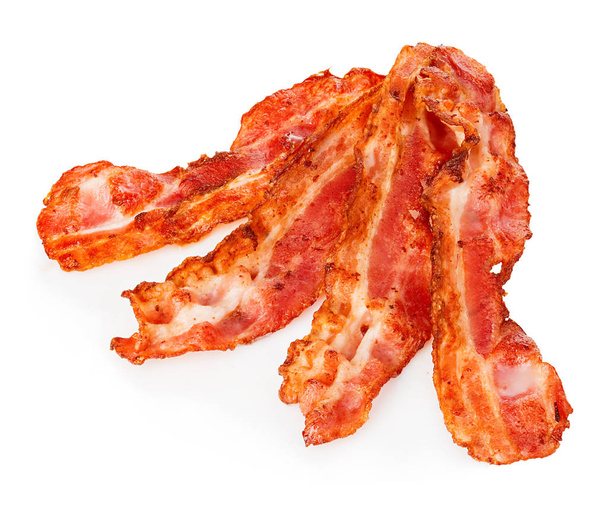 Cooked bacon rashers close-up isolated on a white background. - Photo, Image
