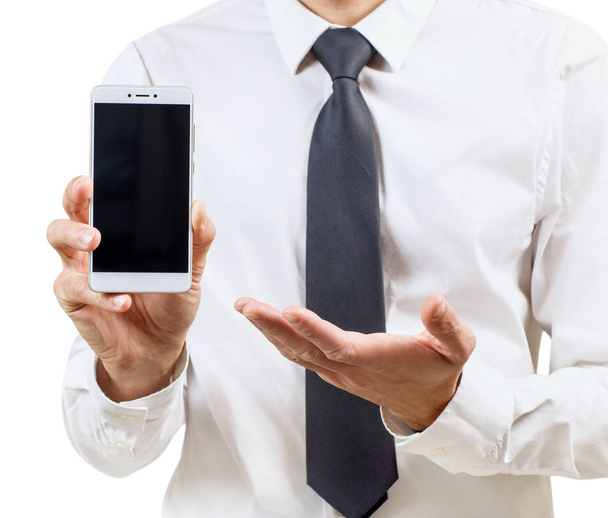 Businessman demonstrates smartphone with black screen. - Fotó, kép