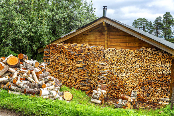 Woodpile with wood in a country house. - Fotoğraf, Görsel