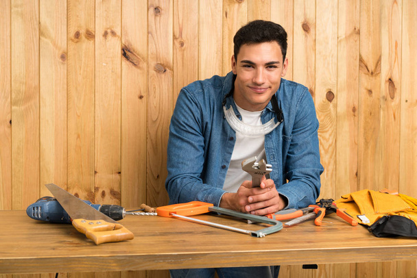 Craftsmen man over wood background - Photo, Image
