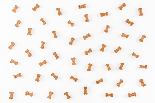 dog snack like bones on white background, flat lay - Photo, Image
