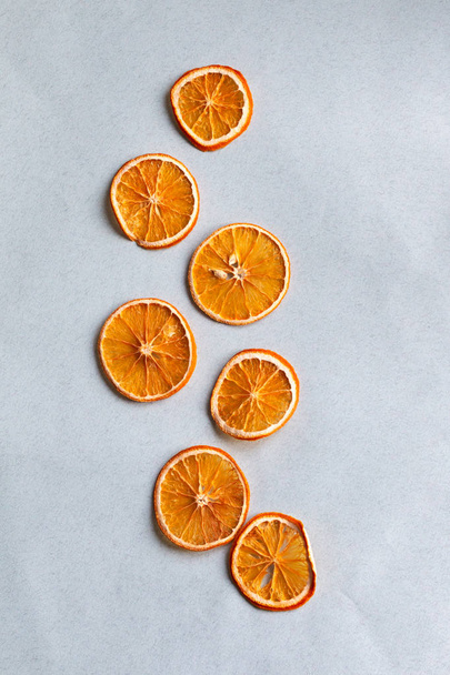 background with dried oranges, top view on sliced oranges - Photo, Image