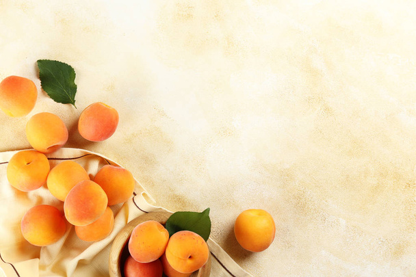 Minimalistic bacground with ripe orange juicy apricots. - Φωτογραφία, εικόνα