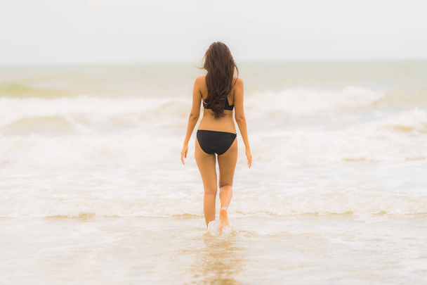 Portrait beautiful young asian woman wear bikini on the beach se - Фото, зображення