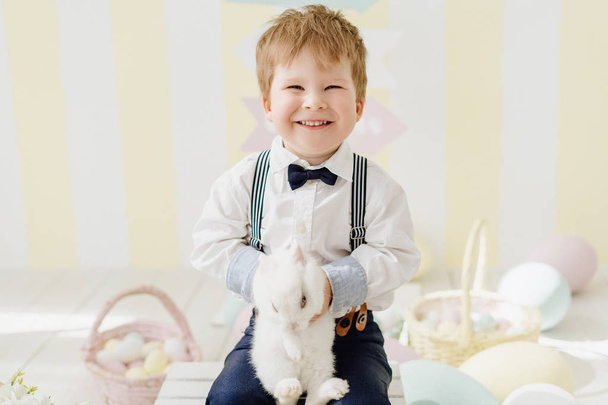 Smiling Little Boy Playing with Easter Rabbit - Fotoğraf, Görsel