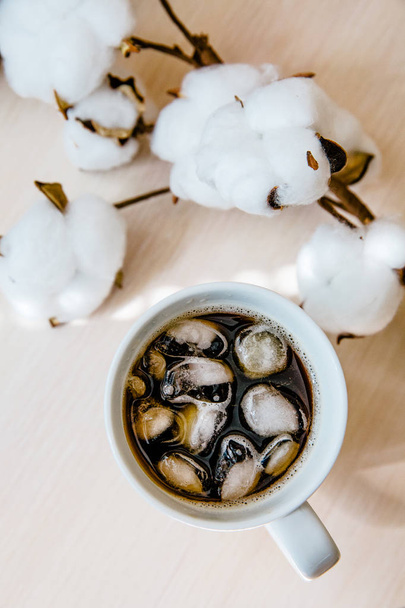 black coffee in a cup on white table  - Фото, зображення