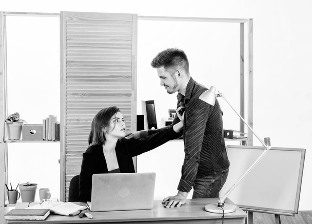 From platonic friendship into romantic love. Romantic couple conducting workplace affair. Boss and secretary having romantic relationship. Romantic partnership of bearded man and sexy woman in office - Photo, image