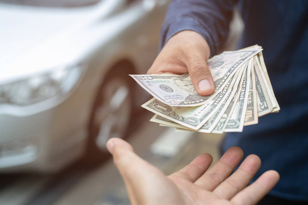 Businessman Person holding a wallet in the hands of take money out of pocket stand front car prepare pay by installments - insurance, loan and buying car finance concept insurance, payment a car - Photo, Image