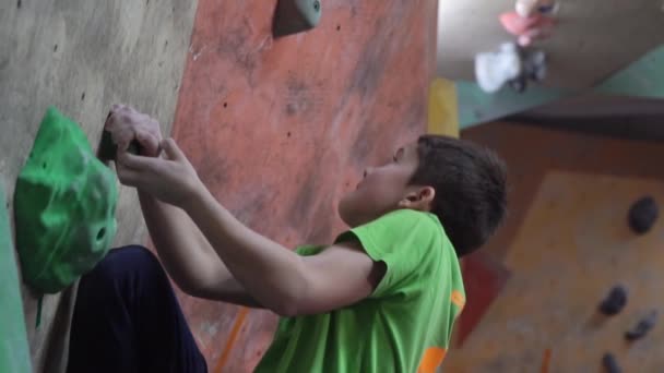 Children train in a climbing gym - Footage, Video