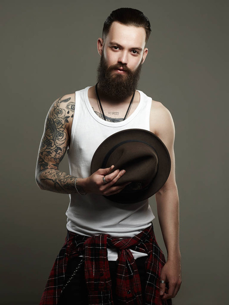 Tattooed handsome Bearded Man with Hat - Fotoğraf, Görsel