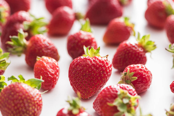 selective focus of sweet and red strawberries on white background  - Photo, image