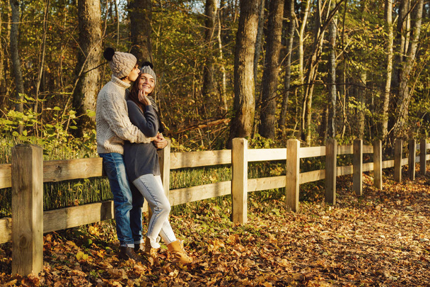 Young couple in the park at sunny autumn day - Foto, Imagen