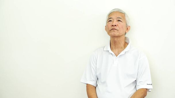 unhappy Asian elderly man expression  - Fotó, kép