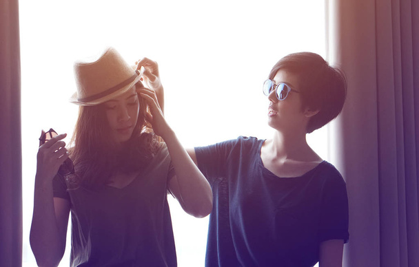 two fashionable asian women pose together - Fotó, kép