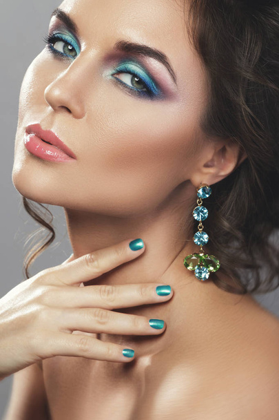 Gorgeous woman wearing beautiful expensive earrings with jewels - Foto, imagen