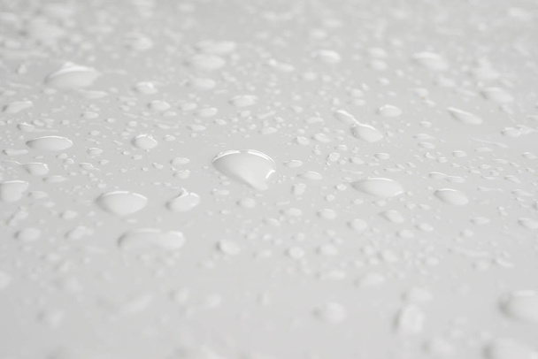 water drop on white background drops of rain on car - Photo, Image