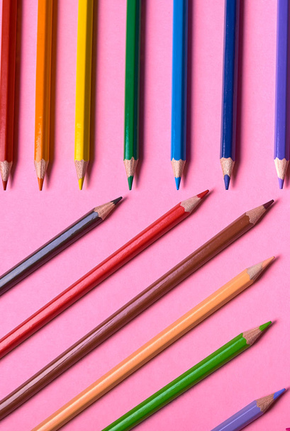 Color pencils on pink pastel background, close up. Set of colorf - Foto, Imagem