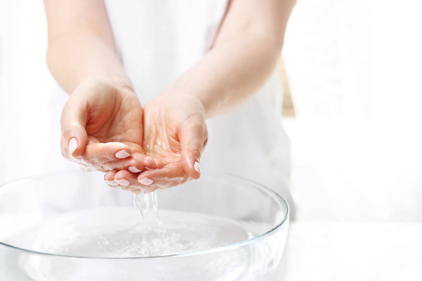 Hand spa. Hand skin care. The woman washes her hands. - 写真・画像