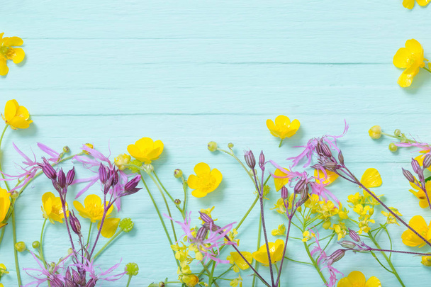 summer flowers on green wooden background  - Fotó, kép