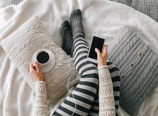 girl home clothes smartphone cup coffee bed - Φωτογραφία, εικόνα