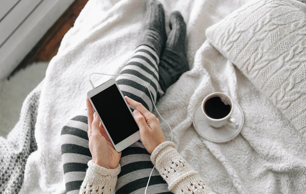 girl home clothes smartphone cup coffee bed - Φωτογραφία, εικόνα