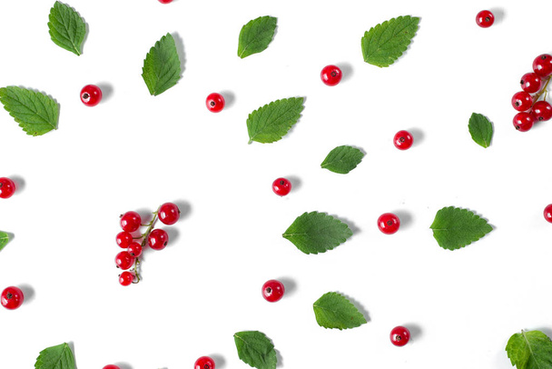 Fruit pattern made of fresh berries and green leaves on white background. Concept of healthy food. Flat lay, top view, copy space - Fotografie, Obrázek