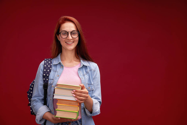 portrait of a beautiful girl student with a backpack and a stack - Foto, Imagem