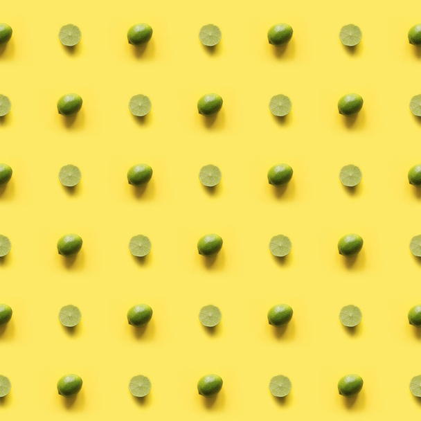 Seamleas limes pattern on punchy yellow background. Creative foo - Foto, afbeelding
