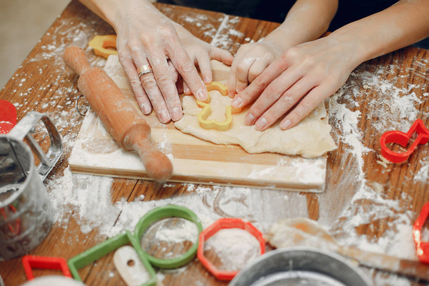 Family cook the dough for cookies - Foto, imagen