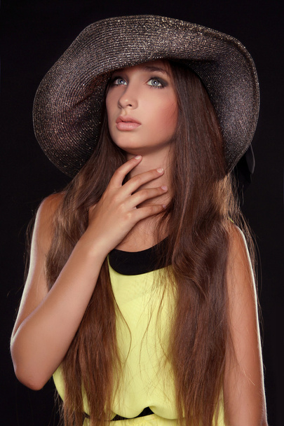 Fashion portrait of beautiful woman posing in hat isolated on bl - Фото, зображення