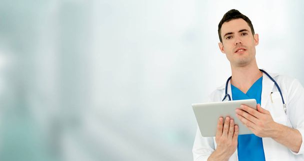 Doctor using tablet computer at the hospital. - Photo, Image
