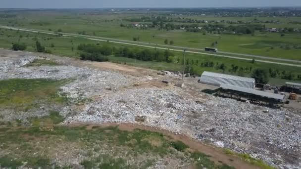 Aerial view of City garbage Dump. Gypsy family with children separates trash to gain some money - Footage, Video