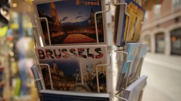 2 in 1 Brussels Postcards in gift shops spinning around - Tourist postcards shop in Brussels. - Footage, Video