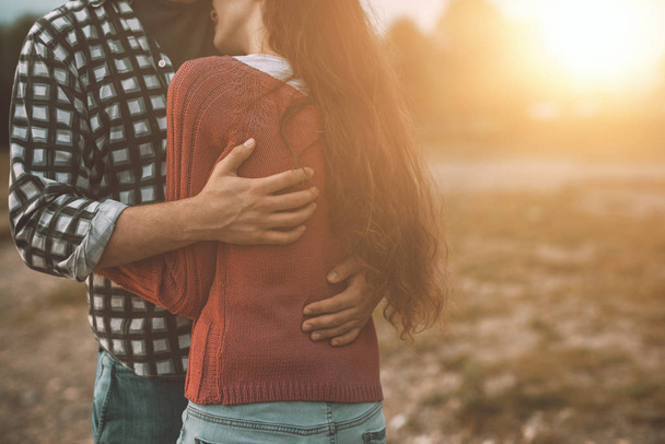 Young loving couple hugging outdoors - Fotó, kép