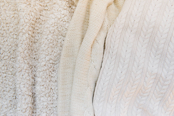Different knitted textures of beige color. Knitted textures, different patterns. Knitted fabric close-up. abstract. background - Fotografie, Obrázek