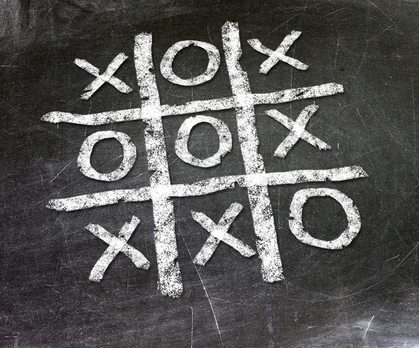 Noughts and crosses drawn by hand on a chalkboard - Valokuva, kuva