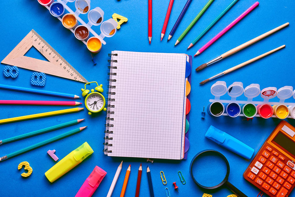 Back to school concept on a blue background - Фото, изображение