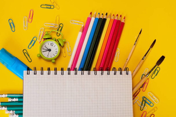 Education concept. Stationery for school on yellow background  - Foto, Imagen
