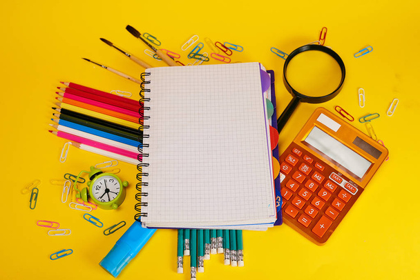 Education concept. Stationery for school on yellow background  - Foto, immagini