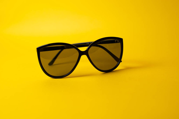 sunglasses on yellow background - Photo, Image