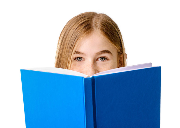 Cute teenage girl with book on white background - Foto, imagen