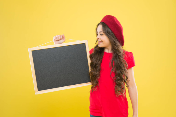 happy school girl in parisian beret. little girl kid with backboard, copy space. board for announcement advertisement. back to school. school shopping sales. kid fashion. Best Service - Photo, Image