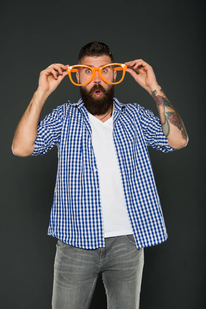 Super crazy surprise. Crazy hipster on grey background. Surprised bearded man wearing funny glasses with crazy look. Being in a crazy mood - Foto, afbeelding